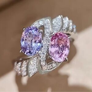 Elegant Silver Ring with Pink and Purple Gemstones.